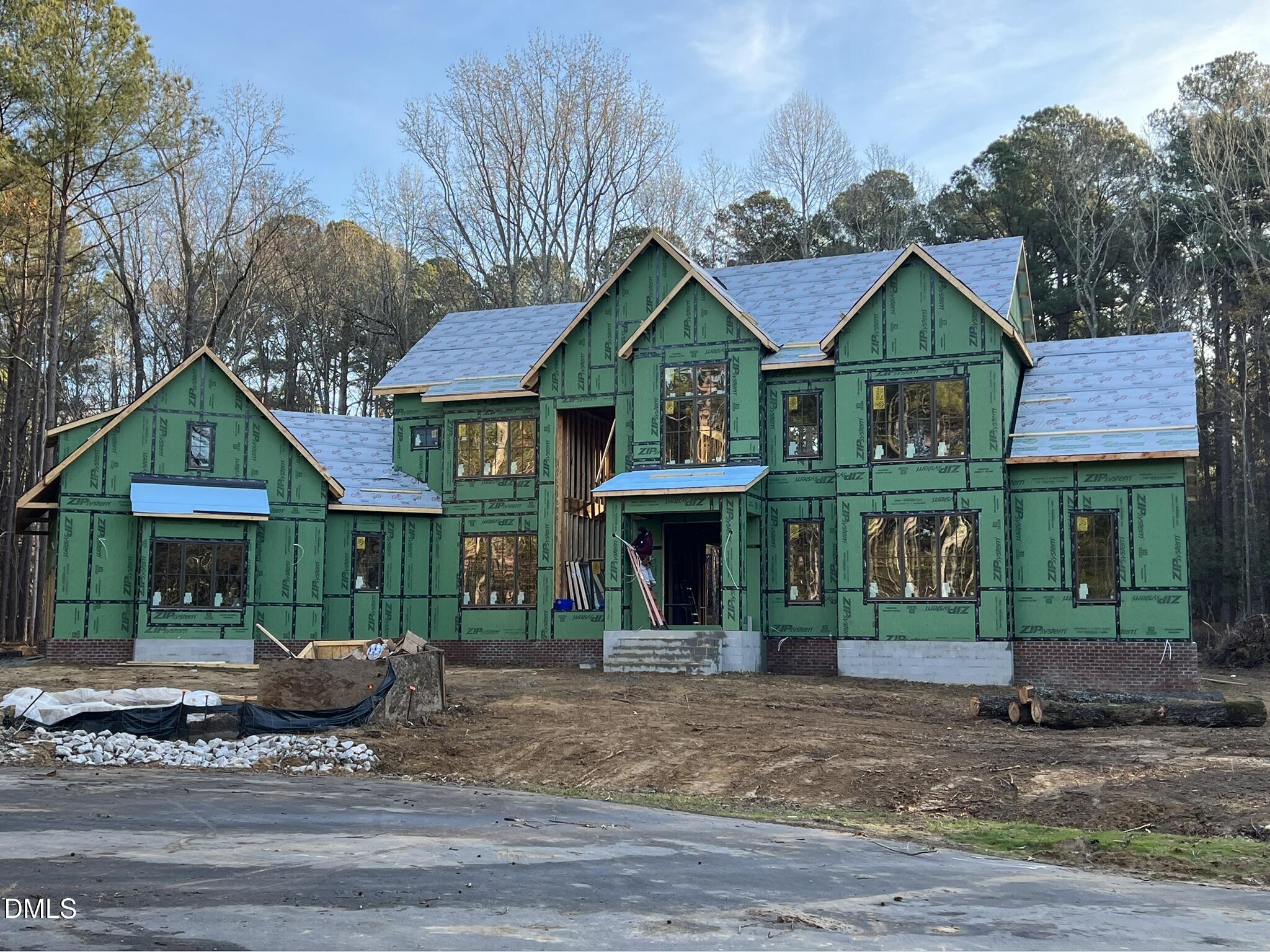 36 Anfield Road New Hill, NC 27562 - Photo 2 of 13 a front view of a house with garden