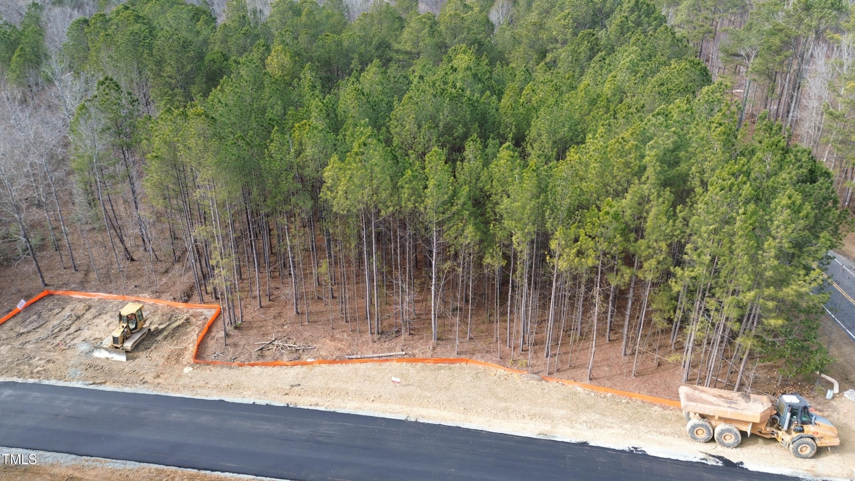 36 Anfield Road New Hill, NC 27562 - Photo 3 of 13 a view of a backyard with wooden floor