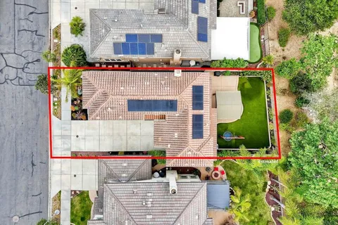a front view of a house with garage and parking