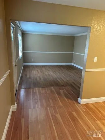 a view of wooden floor and brick walls
