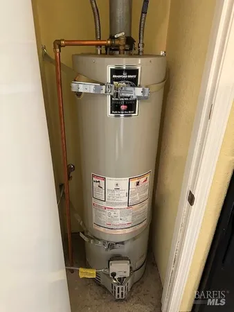 a bathroom with a sink mirror vanity and toilet