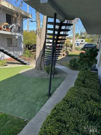 a view of street with parked cars