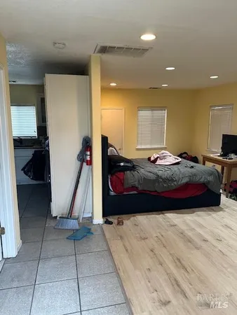 a bedroom with a bed and a walk in closet