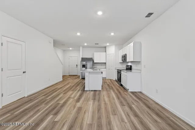 a view of a room with racks on the wall