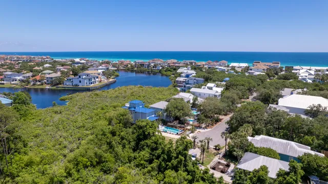 an aerial view of lake residential house with outdoor space and seating