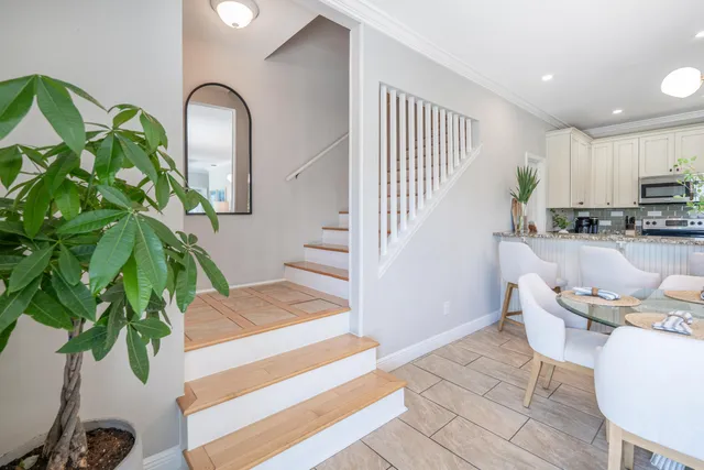 a view of a backyard with sitting area