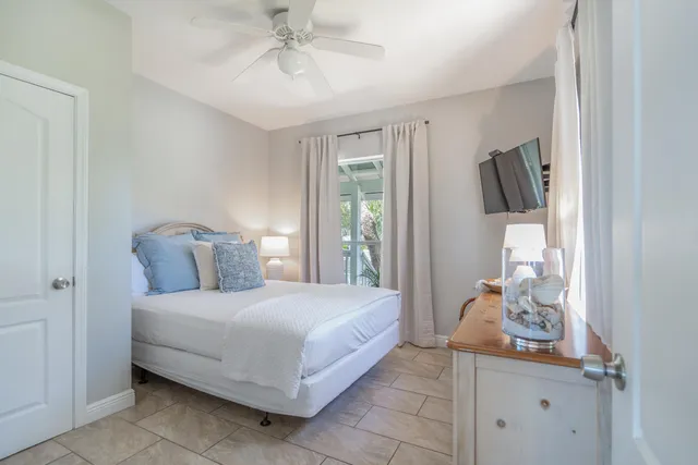 a room that has a bed and a window in it