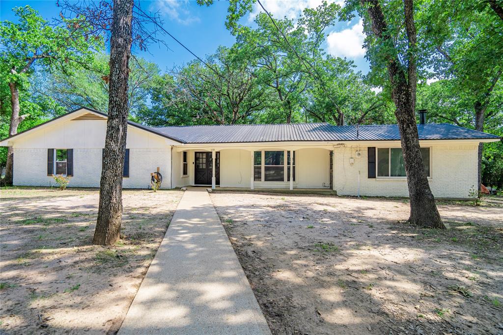 1235 Oak Ridge Drive Terrell, TX 75160 - Photo 1 of 1 a view of a house with a yard and large tree