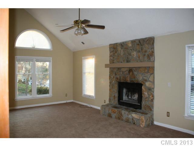 6002 Lanai Lane Tega Cay, SC 29708 - Photo 2 of 16 a view of an empty room with a fireplace and a window