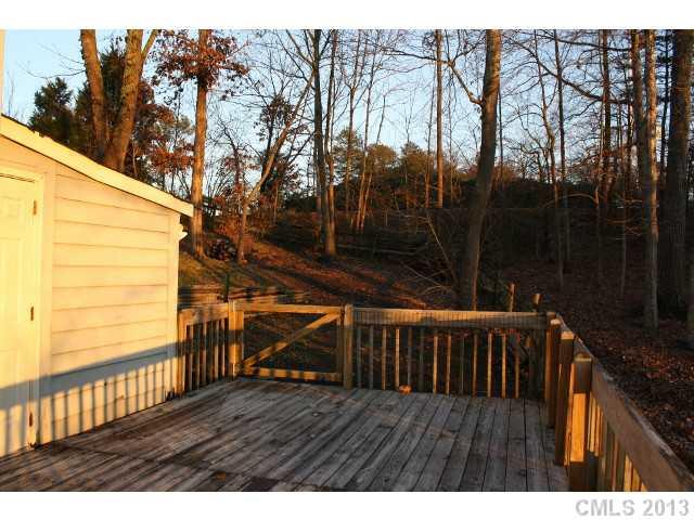 6002 Lanai Lane Tega Cay, SC 29708 - Photo 12 of 16 a view of deck with wooden floor and outdoor seating