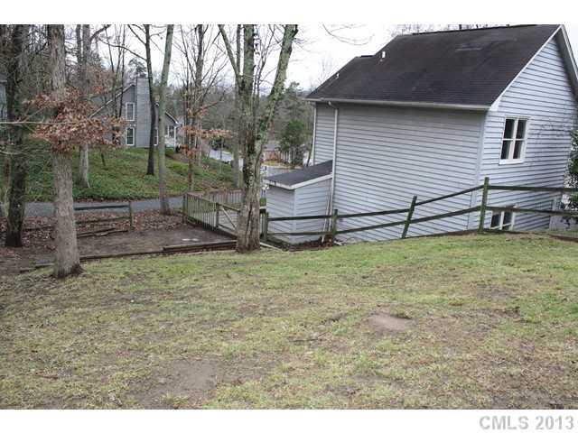 6002 Lanai Lane Tega Cay, SC 29708 - Photo 14 of 16 a backyard of a house with wooden fence
