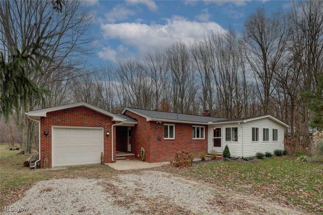 Single story home featuring a garage