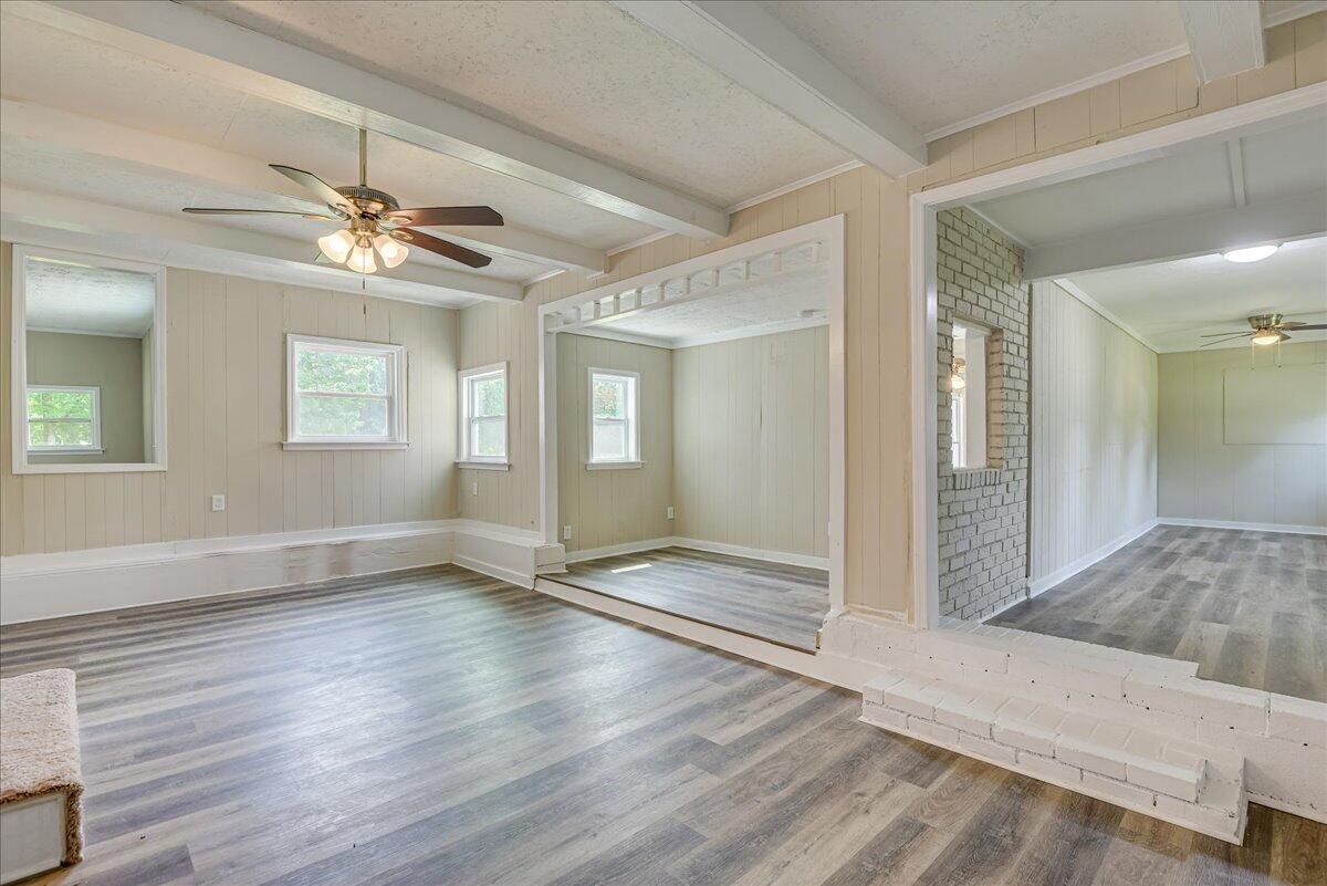 1150 Chico Road Crawfordville, GA 30631 - Photo 23 of 57 Den with wood burning stove