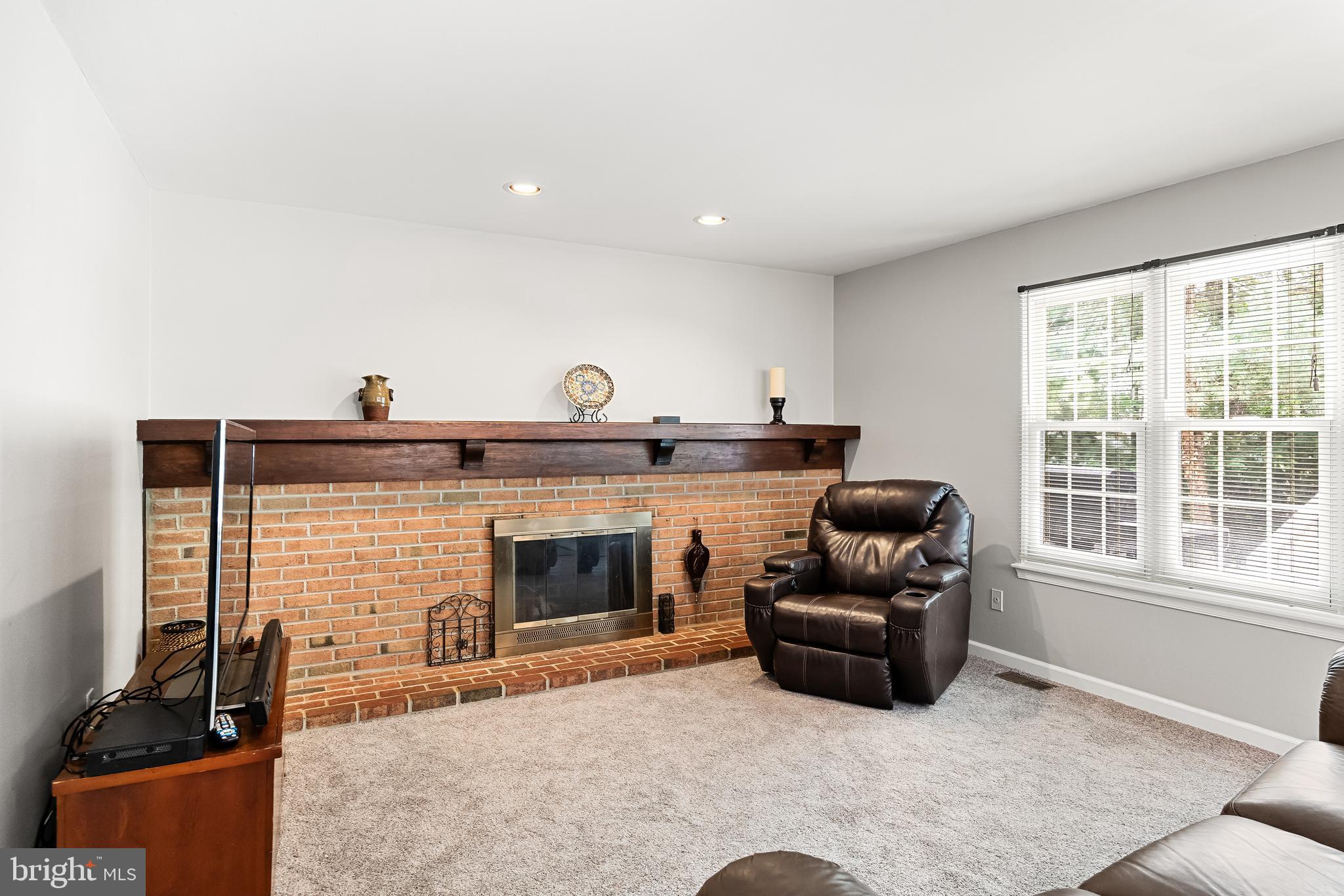 26 Brookview Drive Voorhees, NJ 08043 - Photo 11 of 50 a living room with furniture and a fireplace