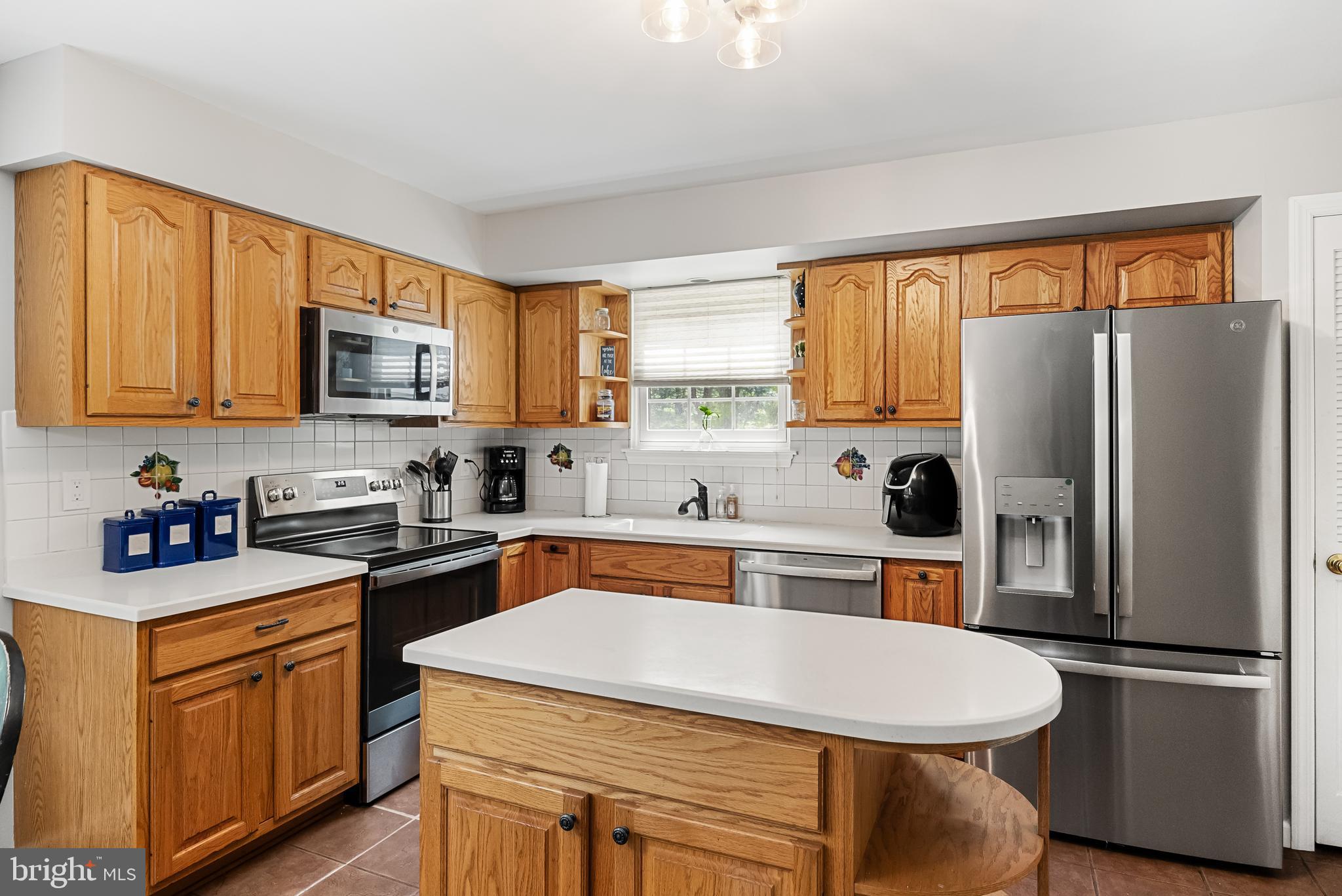 26 Brookview Drive Voorhees, NJ 08043 - Photo 15 of 50 a kitchen with stainless steel appliances a refrigerator stove microwave and sink