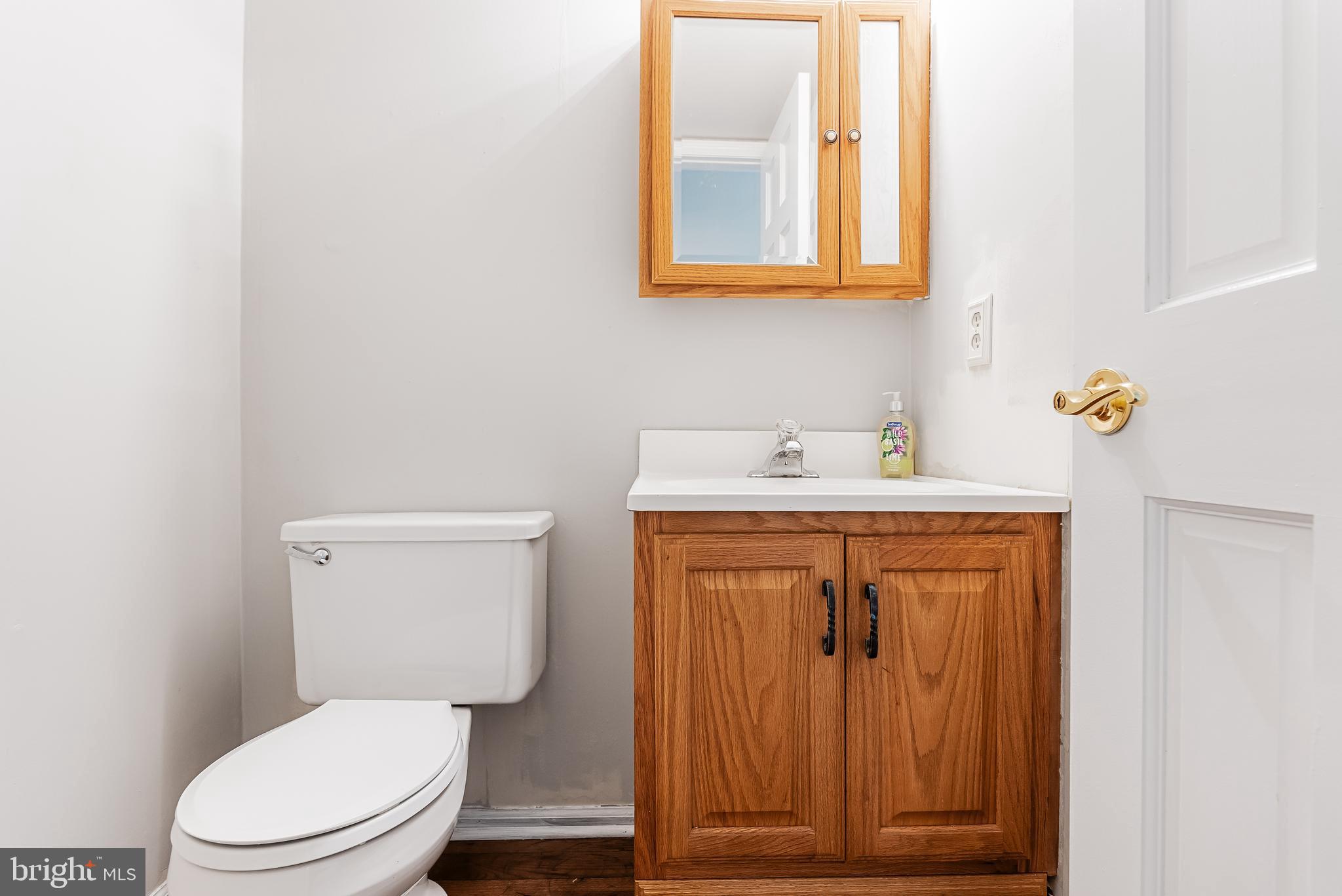 26 Brookview Drive Voorhees, NJ 08043 - Photo 19 of 50 a bathroom with a toilet sink vanity and mirror