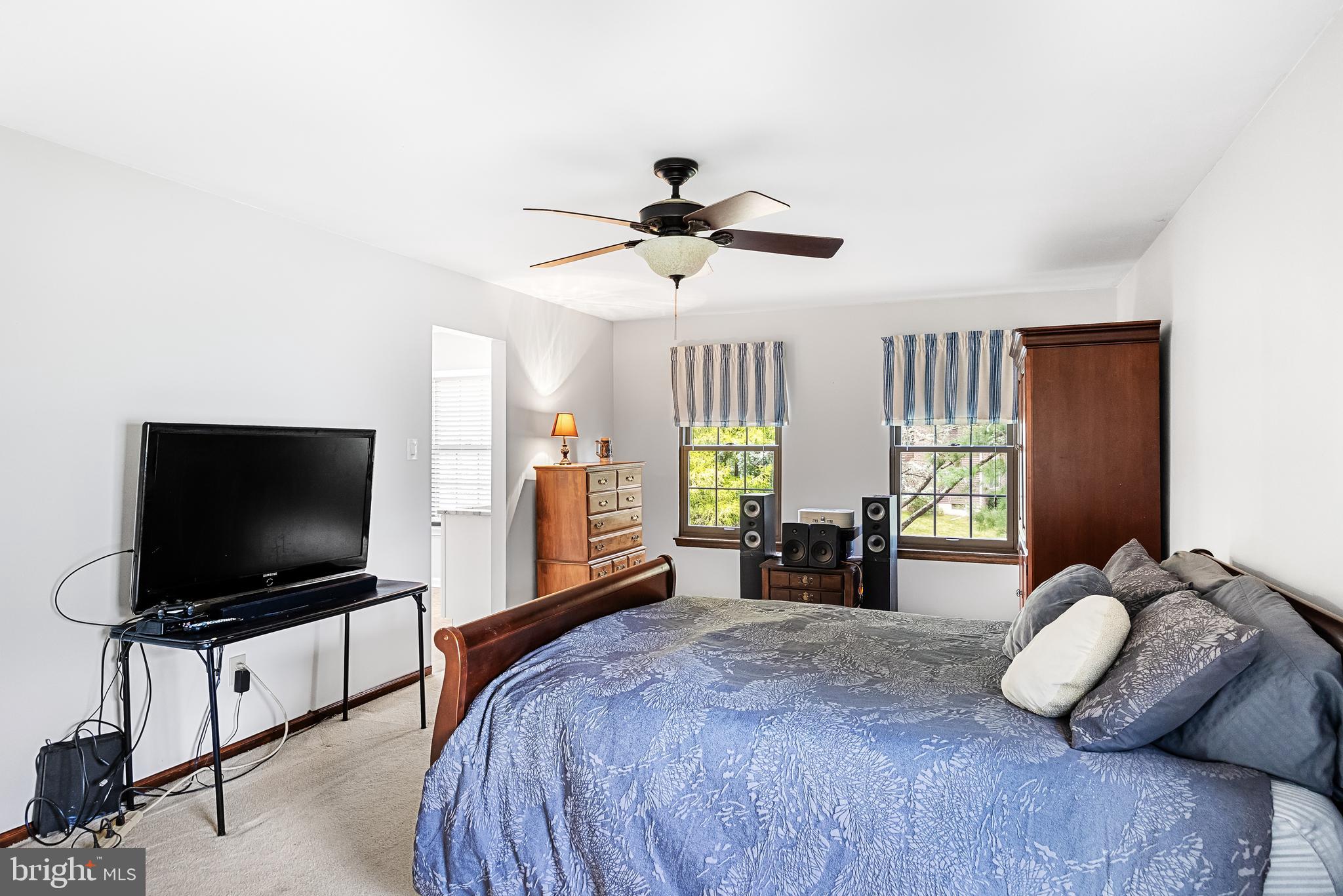 26 Brookview Drive Voorhees, NJ 08043 - Photo 21 of 50 a bedroom with furniture and a flat screen tv