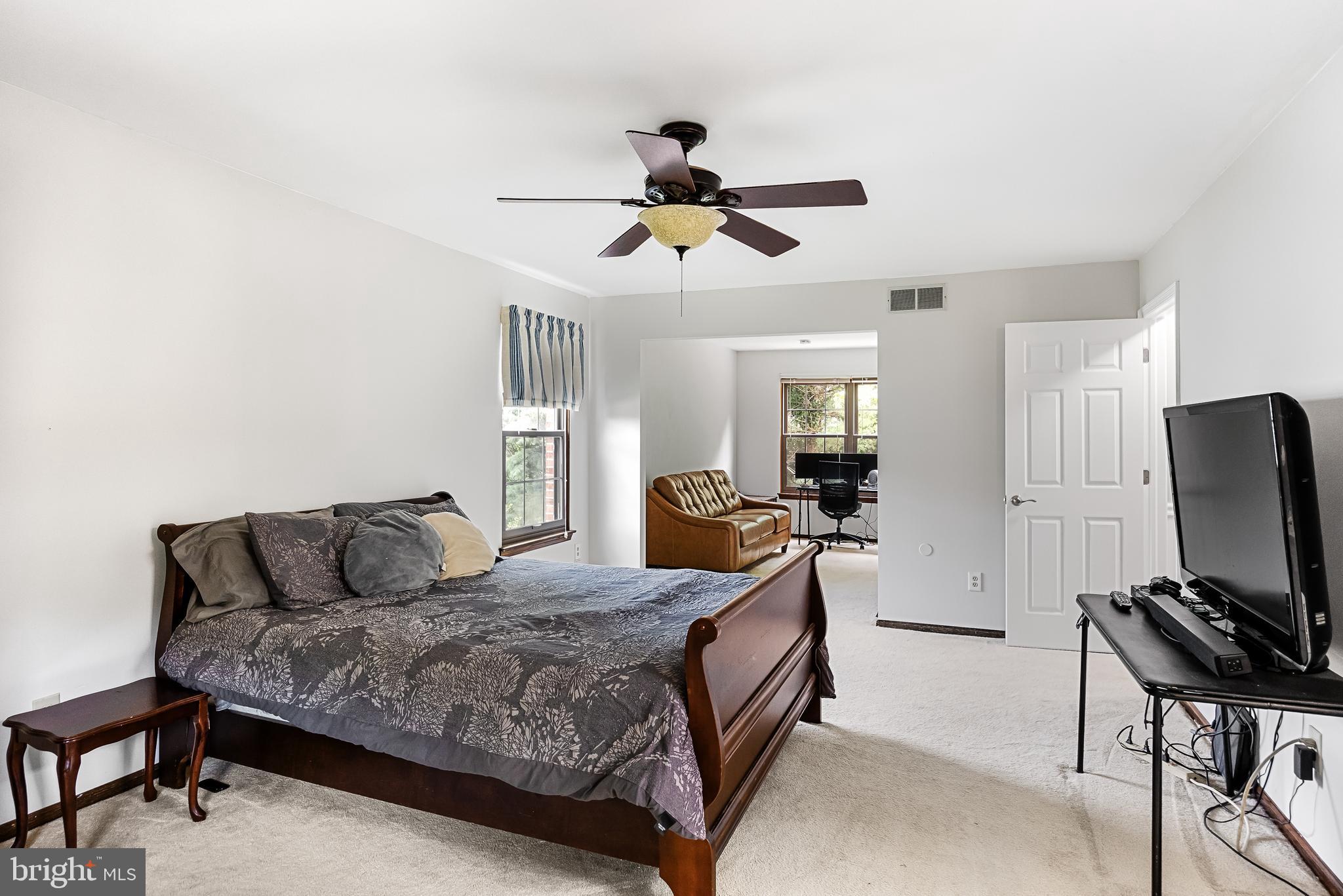 26 Brookview Drive Voorhees, NJ 08043 - Photo 22 of 50 a bedroom with a bed and a flat screen tv