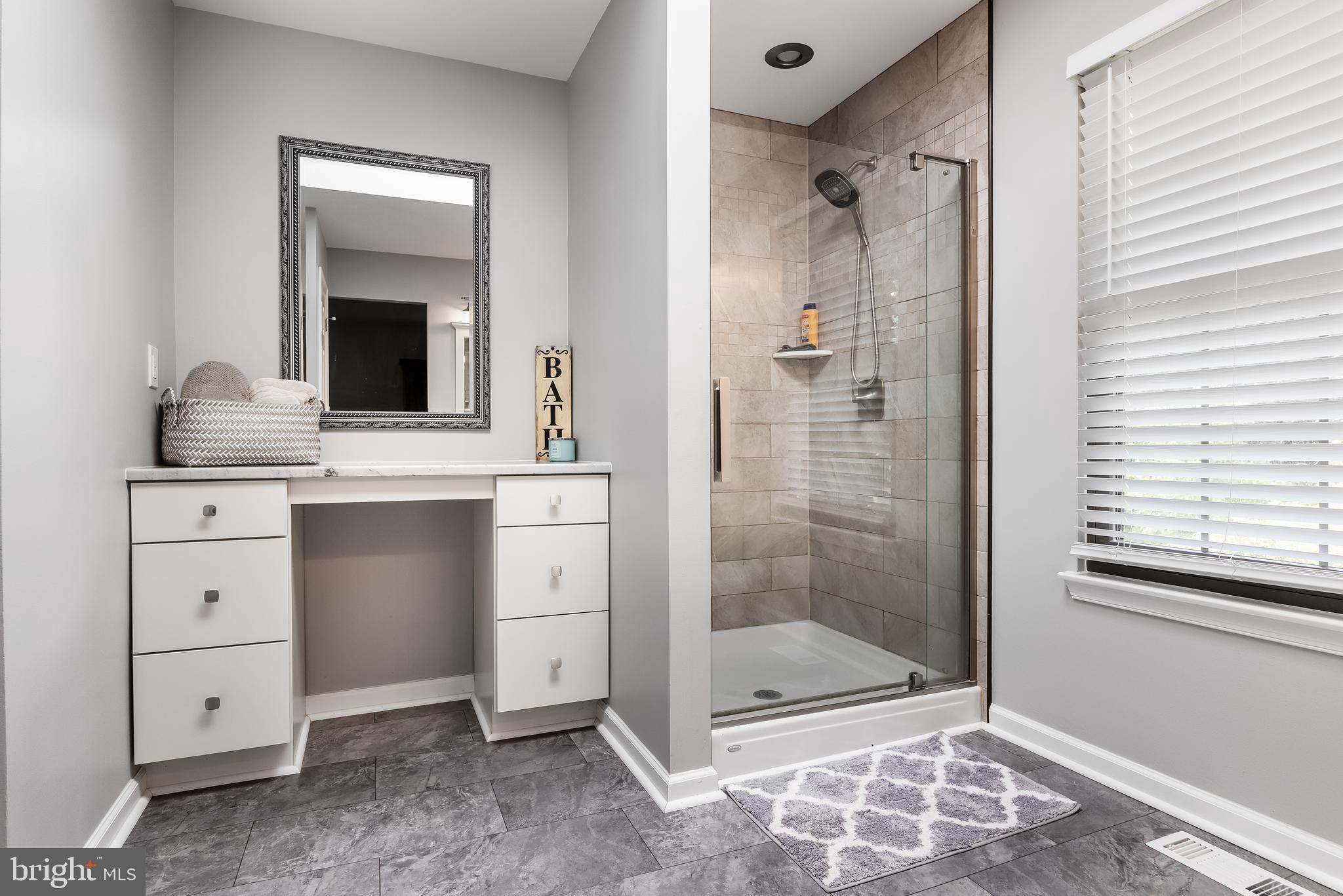 26 Brookview Drive Voorhees, NJ 08043 - Photo 24 of 50 a bathroom with a granite countertop sink mirror and shower