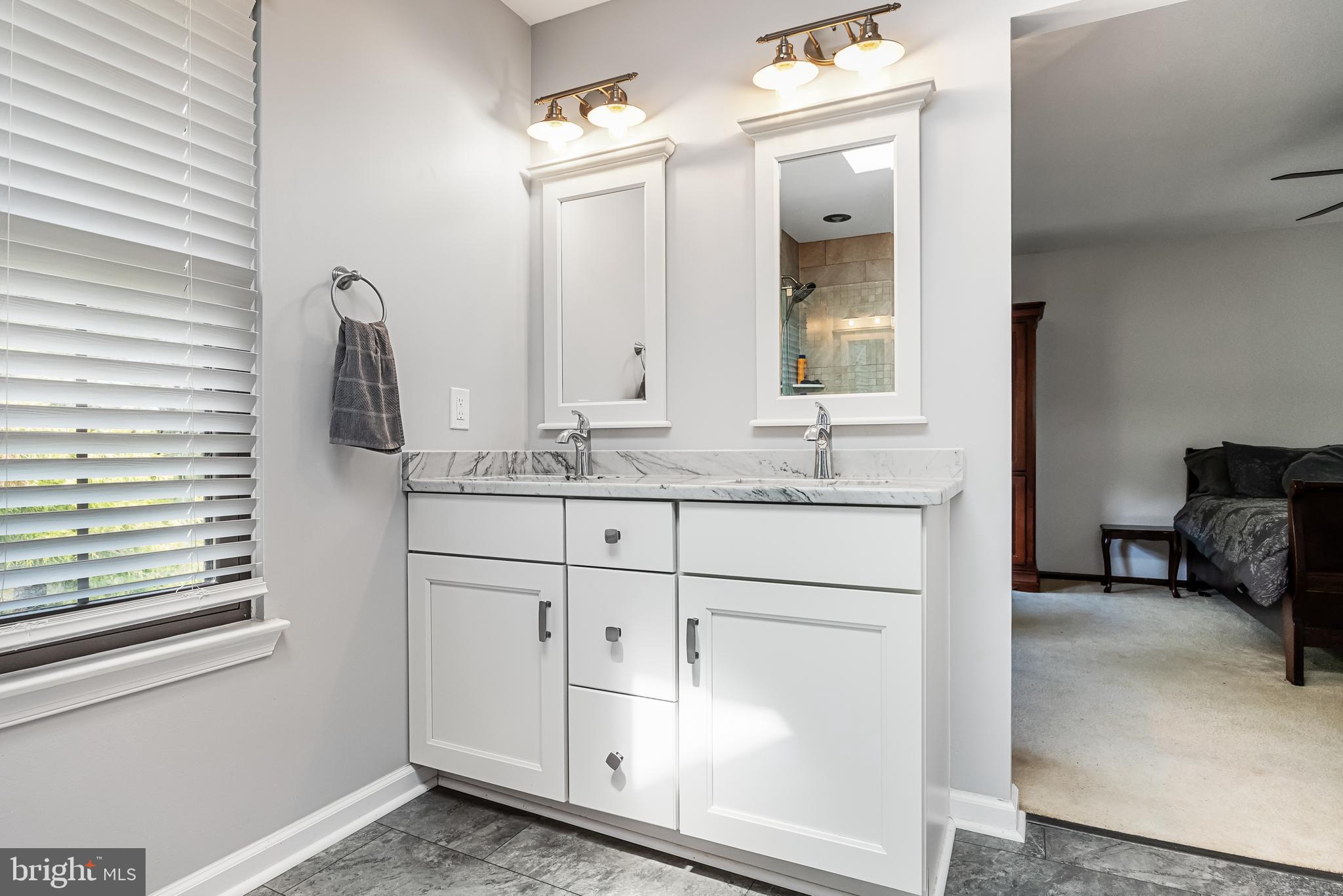 26 Brookview Drive Voorhees, NJ 08043 - Photo 25 of 50 a bathroom with a sink and a mirror