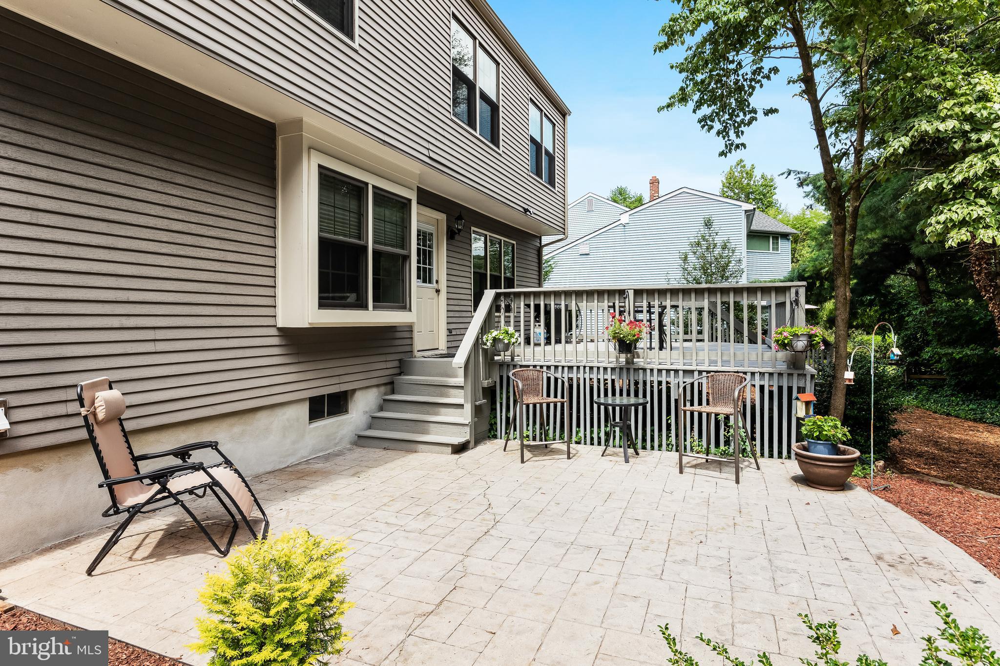 26 Brookview Drive Voorhees, NJ 08043 - Photo 33 of 50 a view of a patio with a bench
