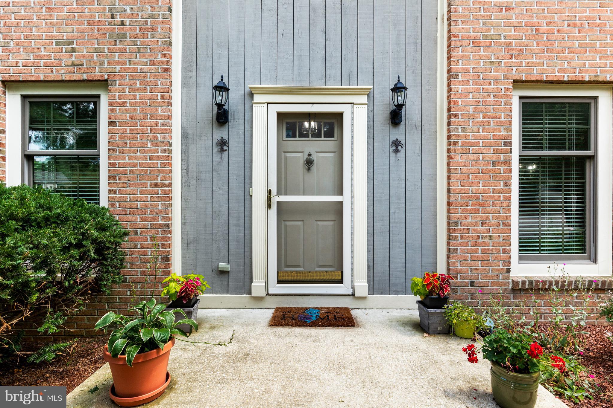 26 Brookview Drive Voorhees, NJ 08043 - Photo 4 of 50 a front view of a house with a potted plant