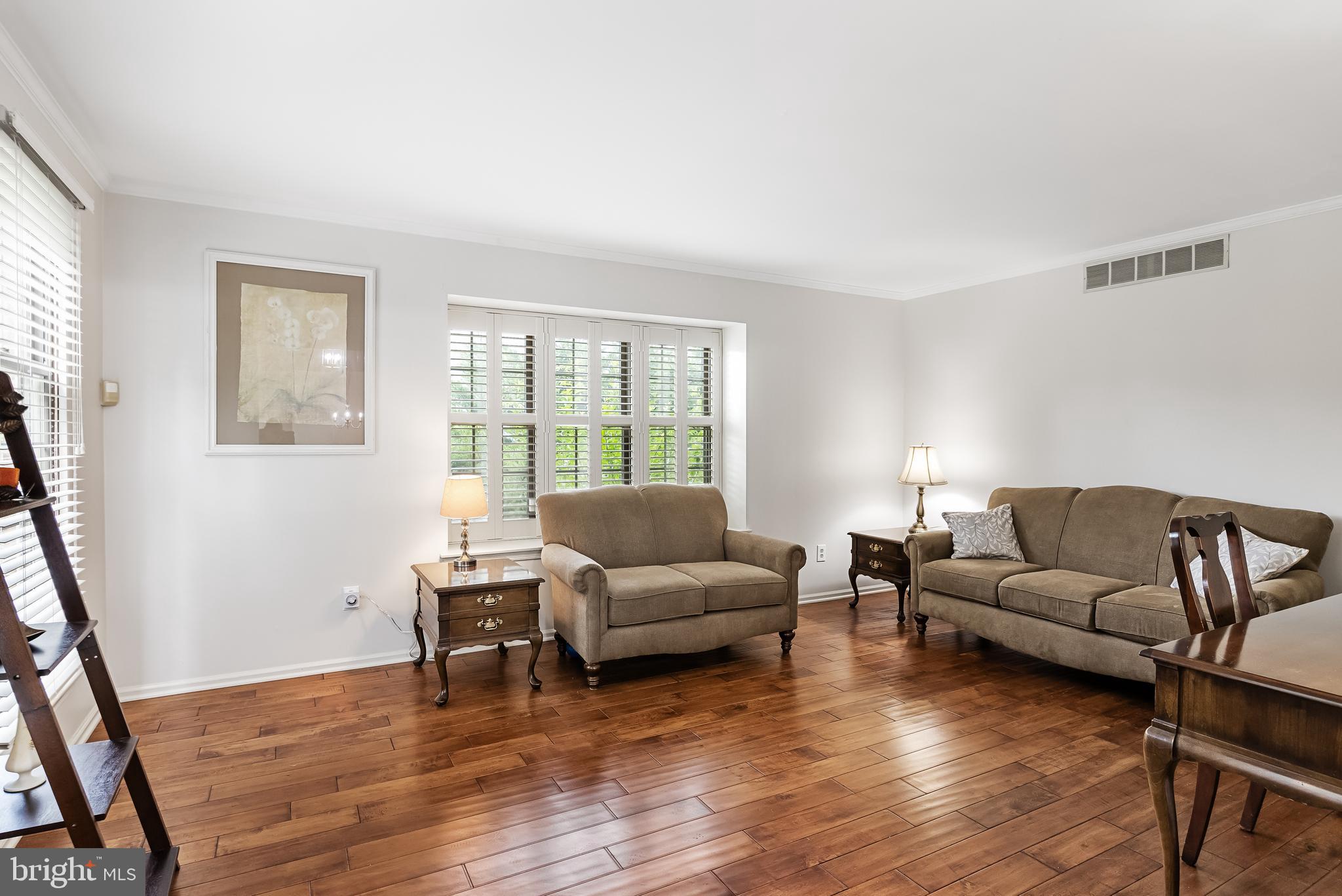 26 Brookview Drive Voorhees, NJ 08043 - Photo 7 of 50 a living room with furniture and a wooden floor