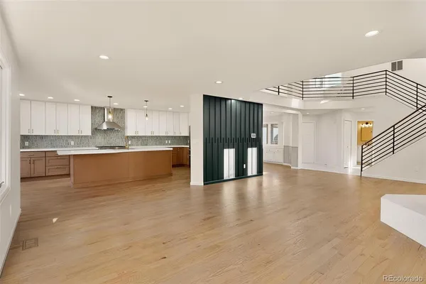 a view of a kitchen with a sink and a refrigerator