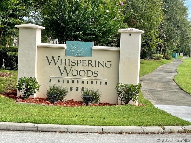 830 Airport Road, Unit 202 Port Orange, FL 32128 - Photo 1 of 35 a sign on the side of the road