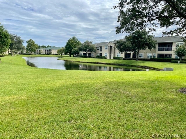 830 Airport Road, Unit 202 Port Orange, FL 32128 - Photo 11 of 35 a view of building with garden in front of it