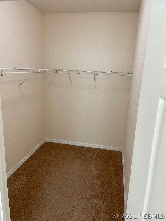 830 Airport Road, Unit 202 Port Orange, FL 32128 - Photo 26 of 35 a view of a room with racks on the wall