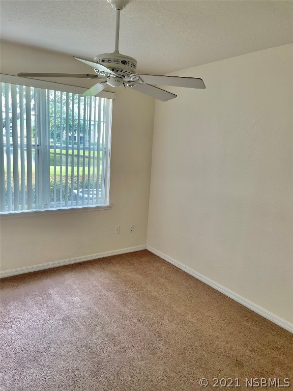 830 Airport Road, Unit 202 Port Orange, FL 32128 - Photo 30 of 35 a view of an empty room with a window