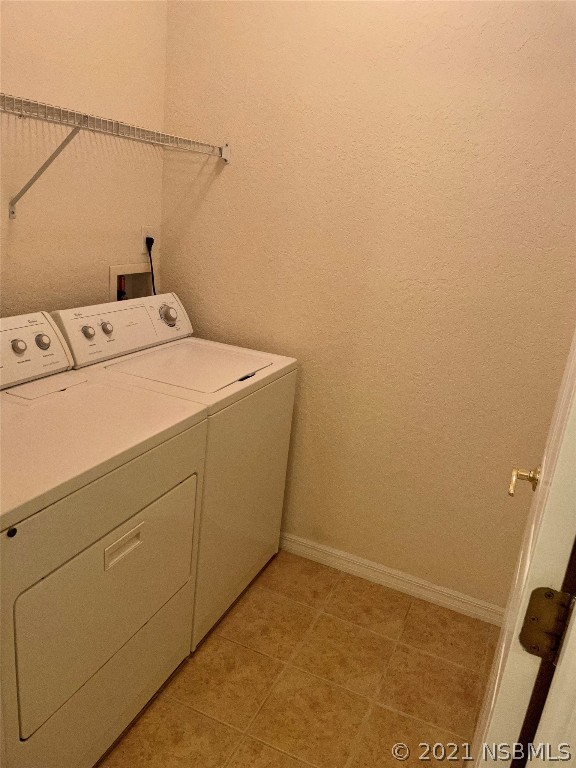 830 Airport Road, Unit 202 Port Orange, FL 32128 - Photo 32 of 35 a utility room with dryer and washer