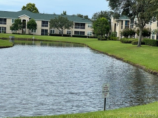 830 Airport Road, Unit 202 Port Orange, FL 32128 - Photo 7 of 35 a view of house with a yard