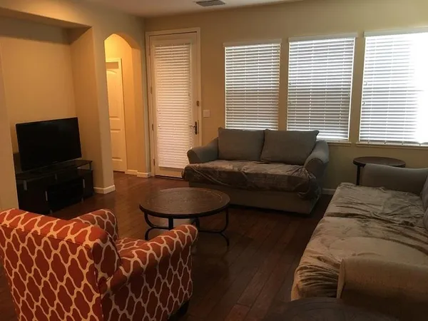 a workspace with furniture and a window