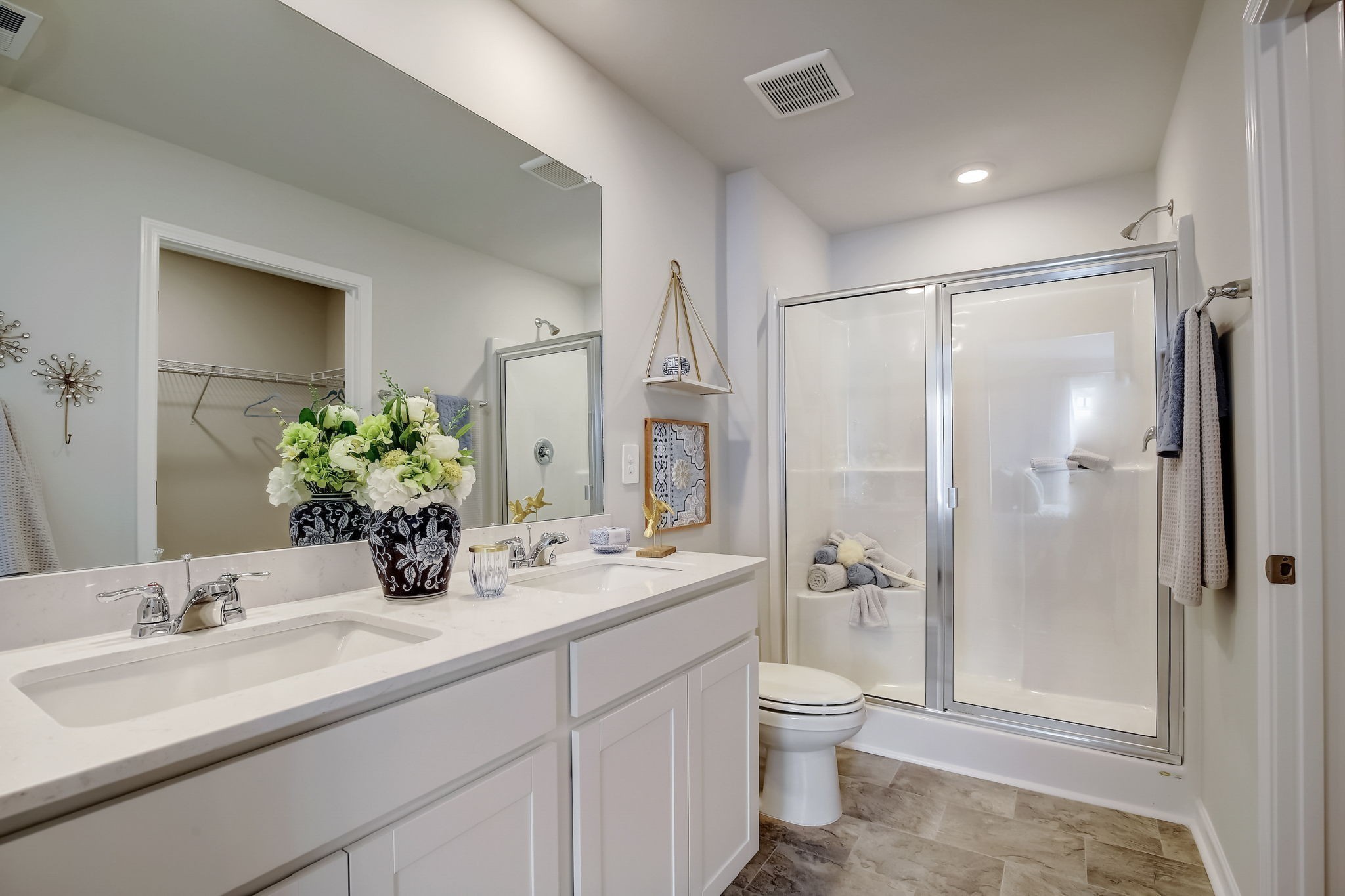 2121 Widgeon Point Lebanon, TN 37090 - Photo 24 of 42 a bathroom with a double vanity sink toilet and shower