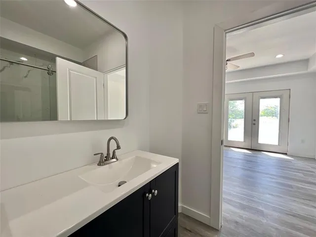 a bathroom with a sink and a mirror