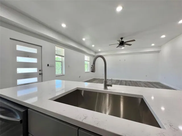 a kitchen with a sink and a refrigerator