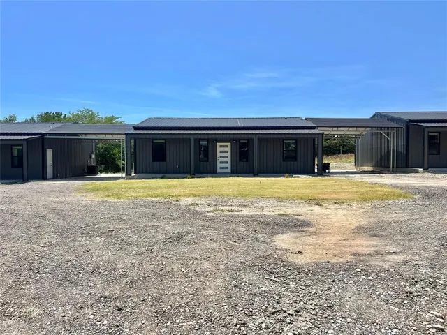 a swimming pool with outdoor seating and yard