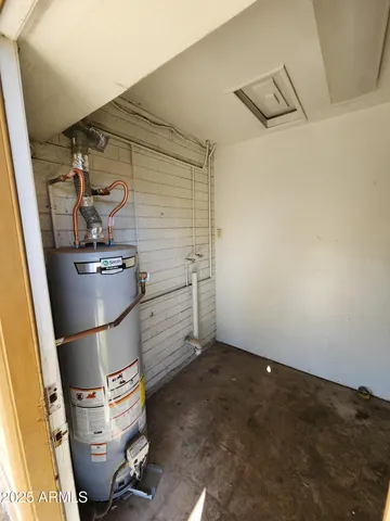 a room with water heater and storage