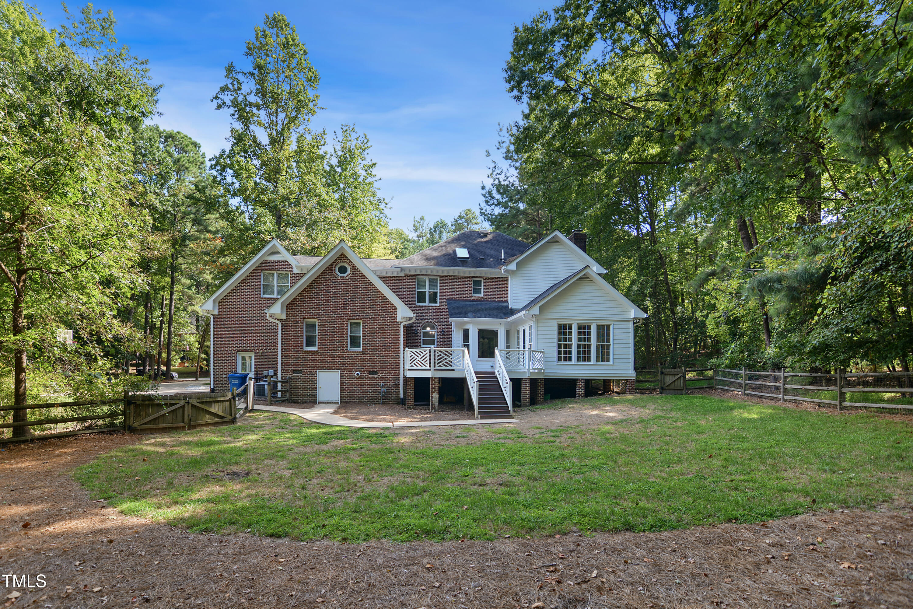 1405 Shadowview Court Raleigh, NC 27614 - Photo 33 of 37 a front view of a house with a garden and trees