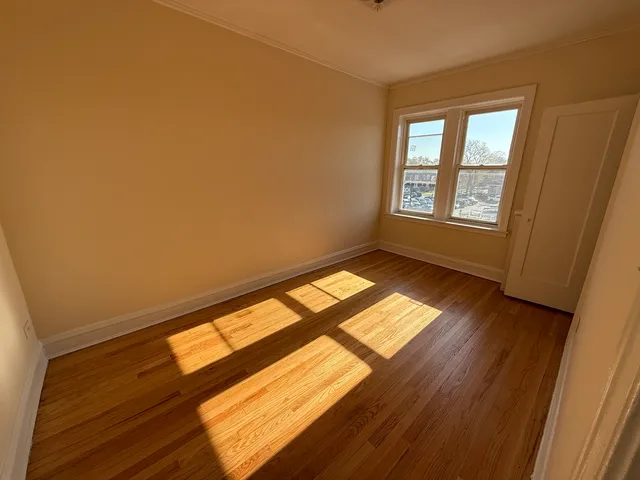 a view of an empty room and a window