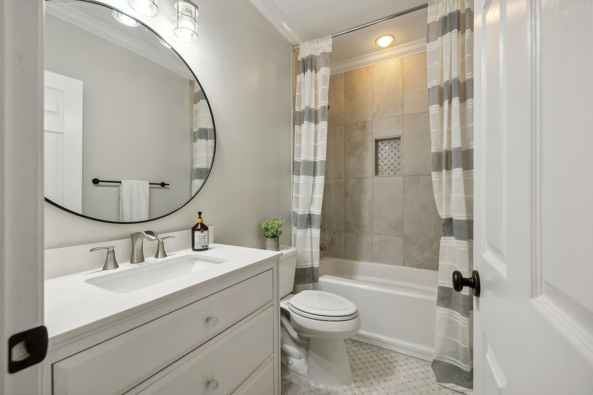 576 Rocky Valley Road Lebanon, TN 37090 - Photo 36 of 62 a bathroom with a sink a toilet and a mirror