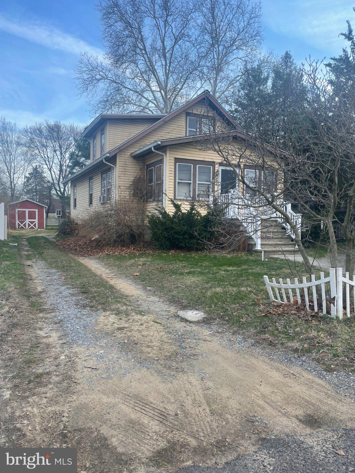 Charming home with inviting driveway.