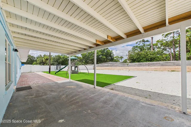 a view of a terrace with a yard