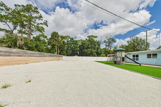 a backyard of a house with lots of green space