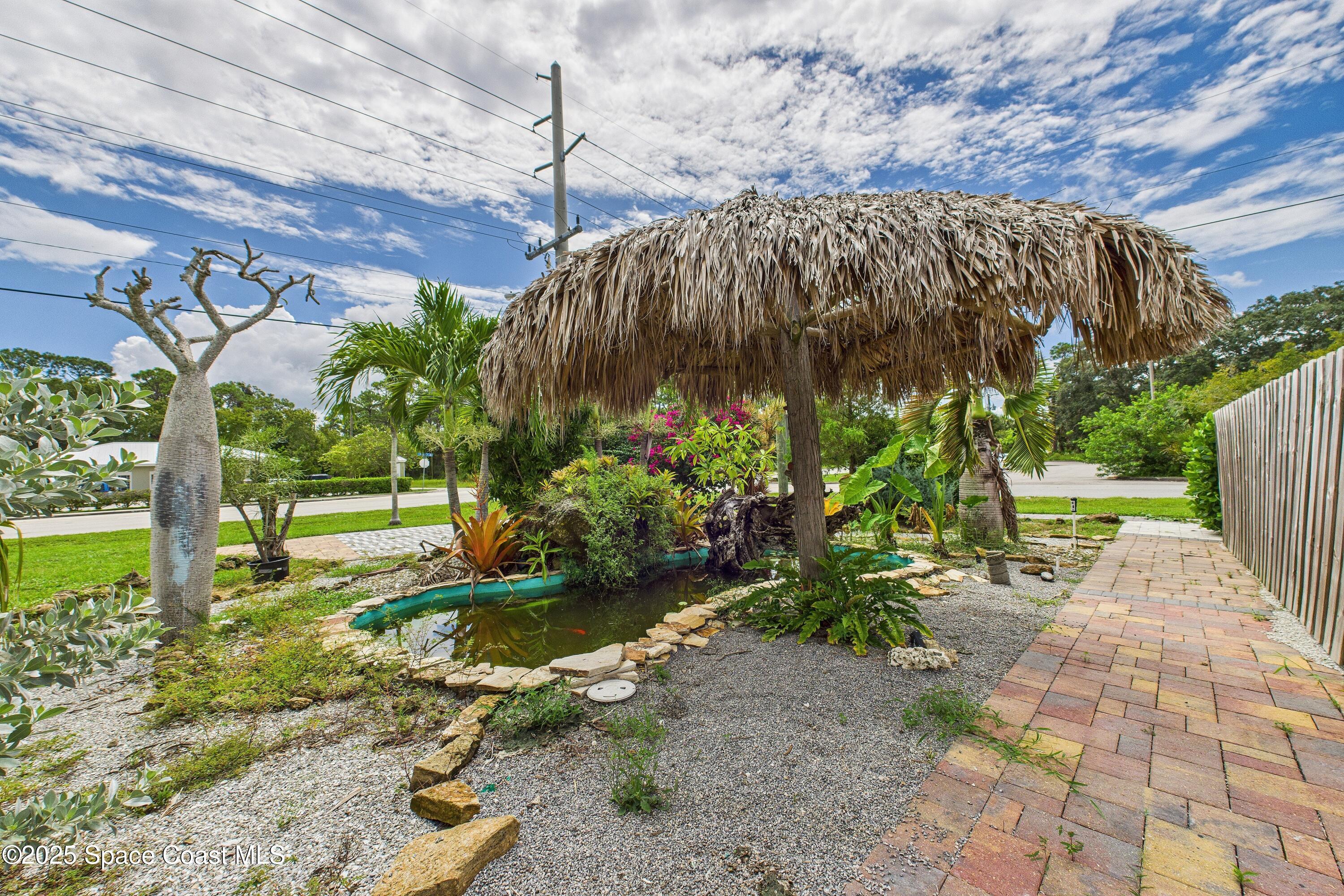 1340 South Wickham Road Melbourne, FL 32904 - Photo 16 of 50 a backyard of a house with lots of green space