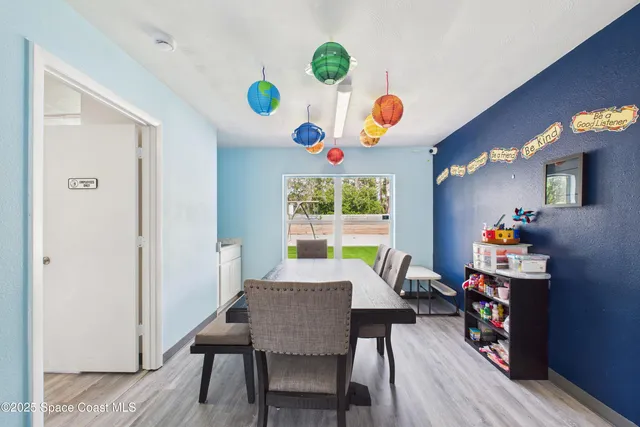 a bedroom with furniture and a large window