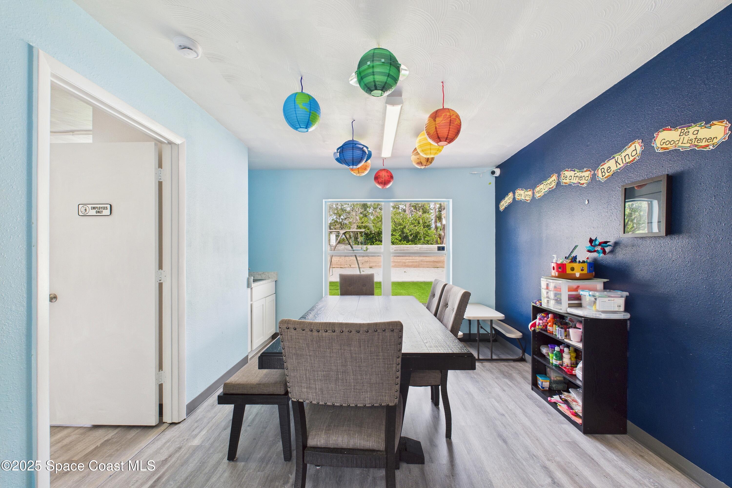 1340 South Wickham Road Melbourne, FL 32904 - Photo 20 of 50 a view of a dining room with furniture and wooden floor