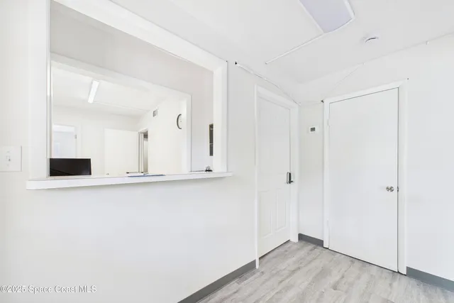 a view of cabinets and wooden floor